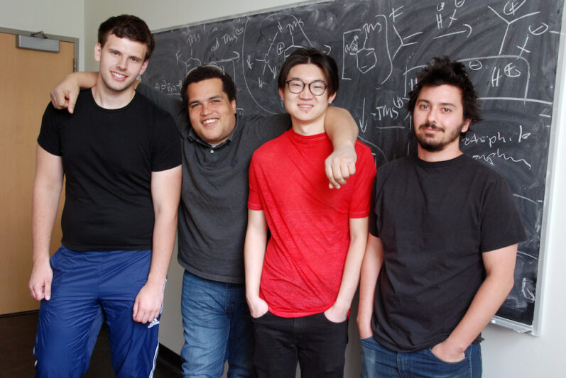 Four students in Nelson Lab group photo
