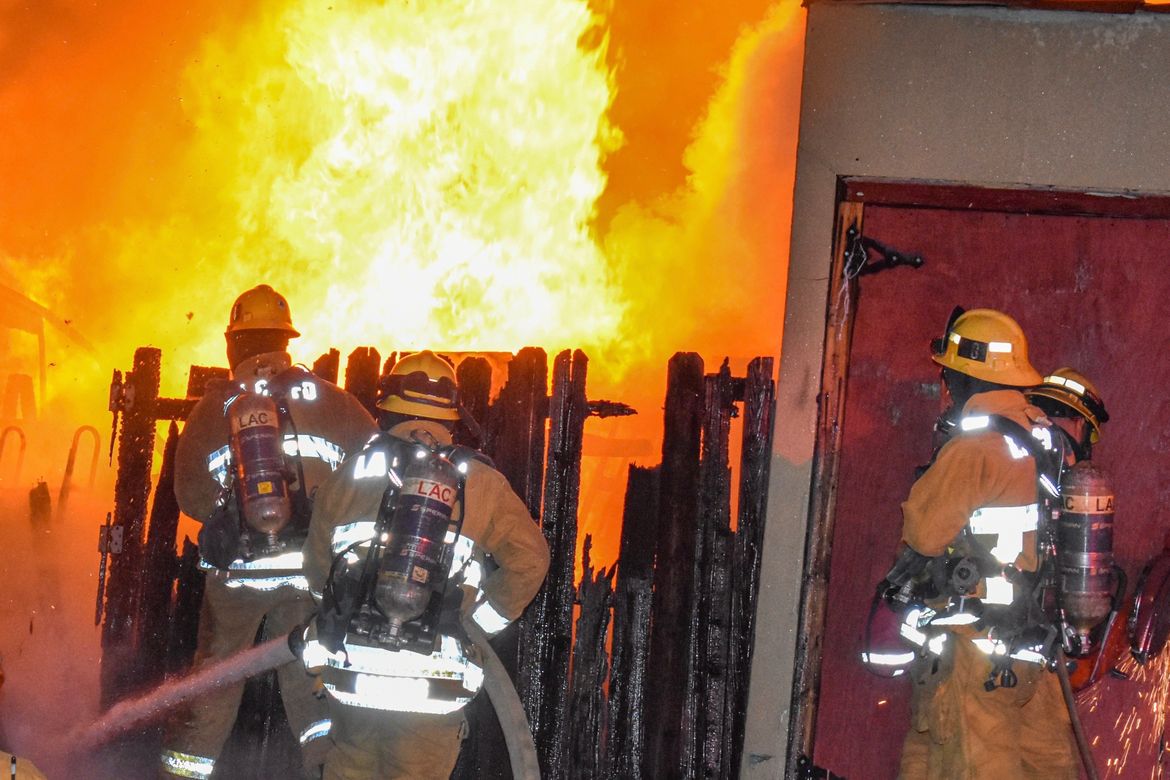 Members of Derek Urwin’s firefighting crew battle a blaze in Inglewood.