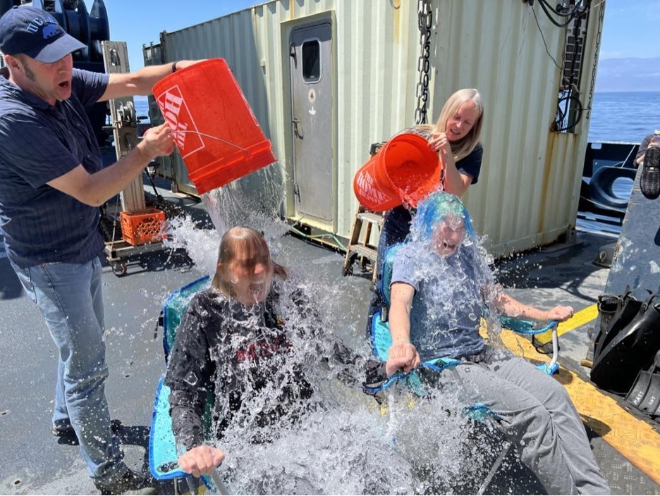Mt. San Antonio College professor Tania Anders and UCLA postdoctoral researcher Kira Homola are baptized with ice-cold water after their first Alvin dive.