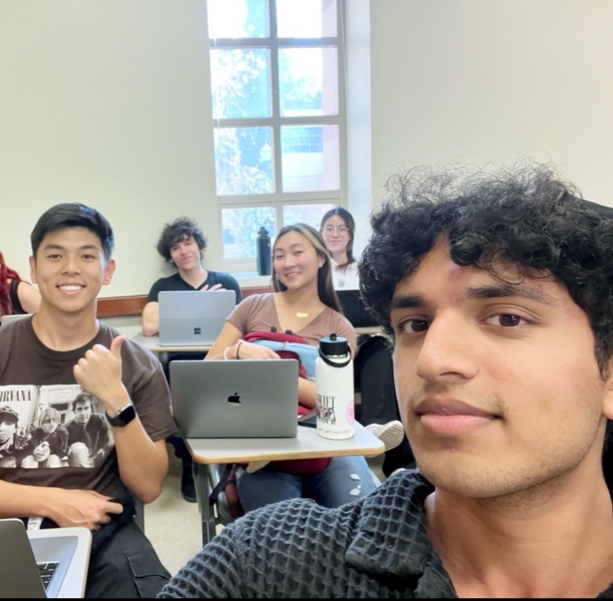 A selfie of Anish with friends in a UCLA classroom