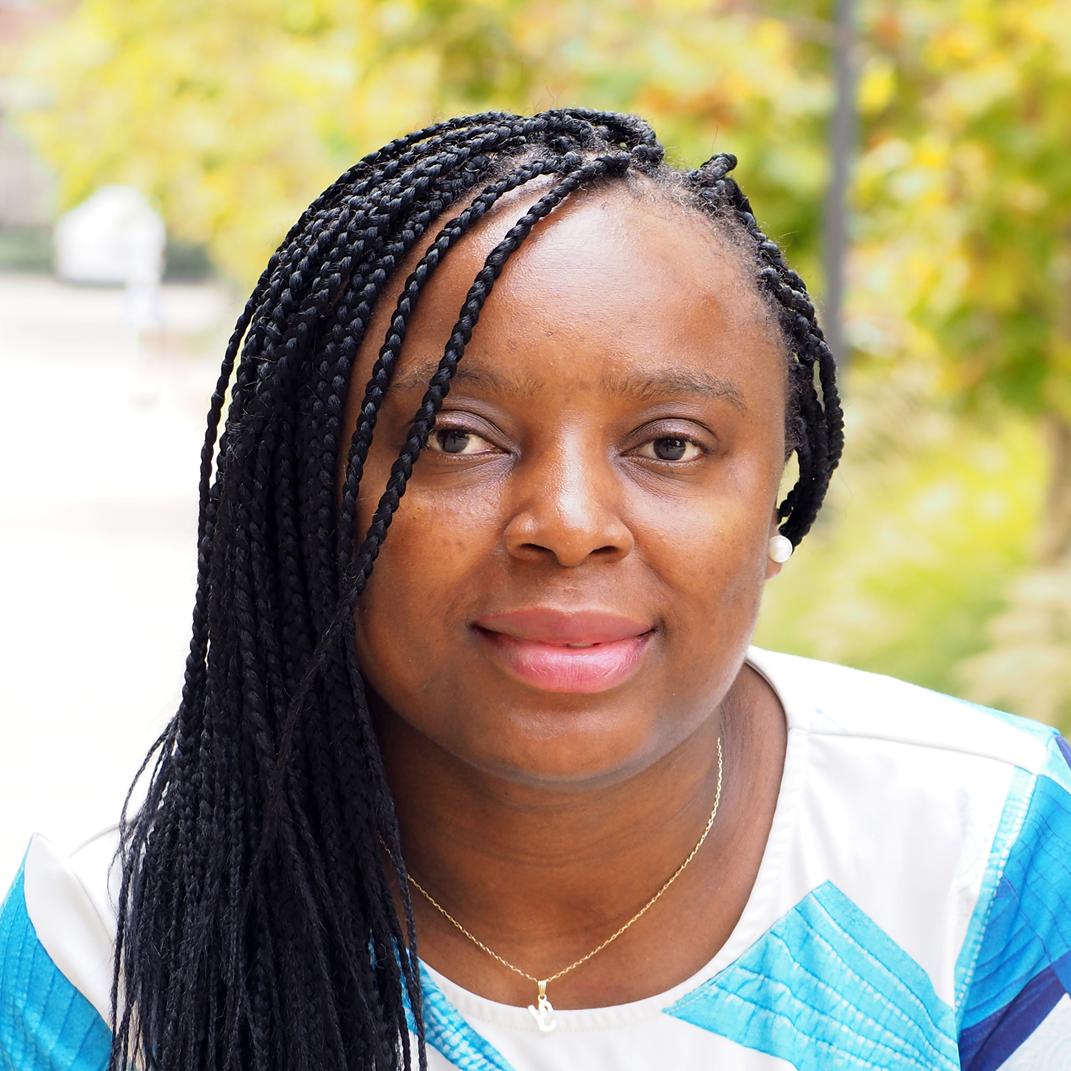 A headshot of professor Alvine Kamaha on the UCLA campus 