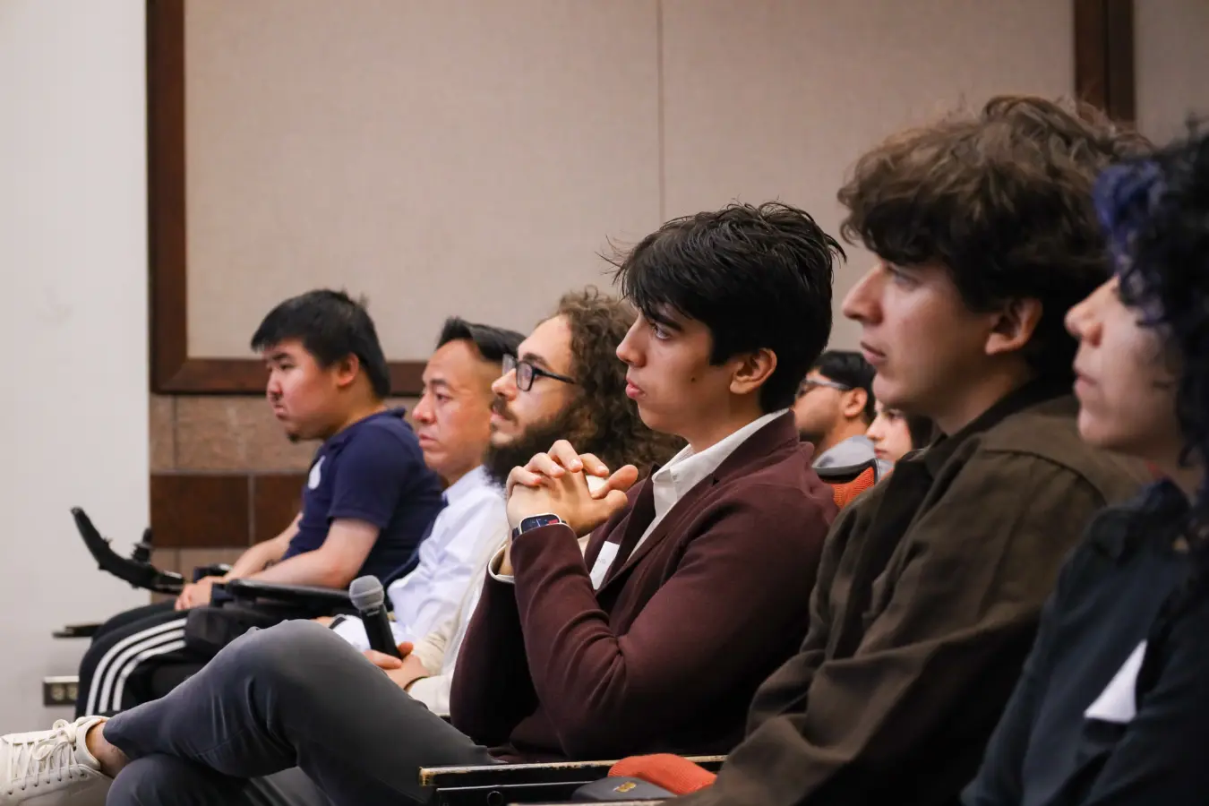 students listen intently in a lecture hall